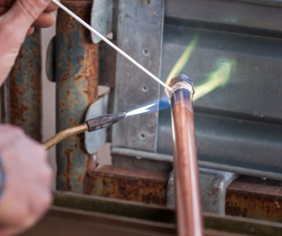 Plumber soldering copper repipe