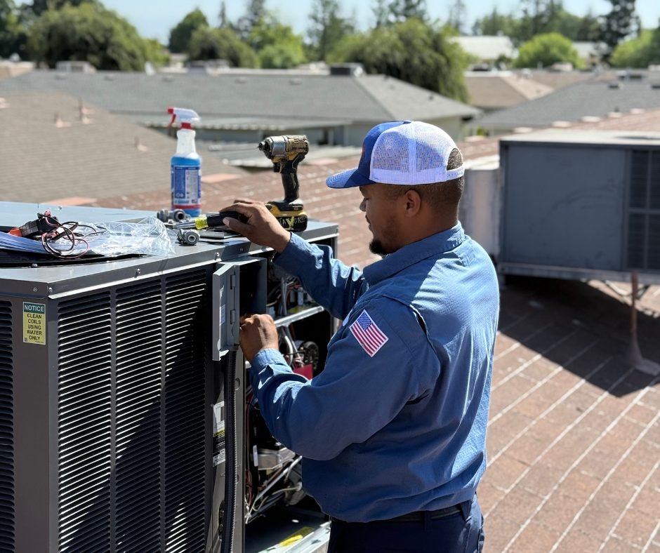 Costless technician performing an air conditioner tune-up in Fresno