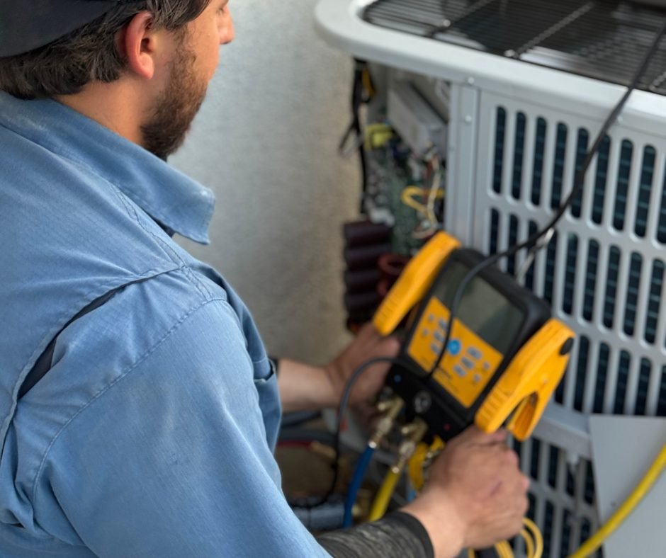 Costless technician repairing an air conditioner in a Fresno home
