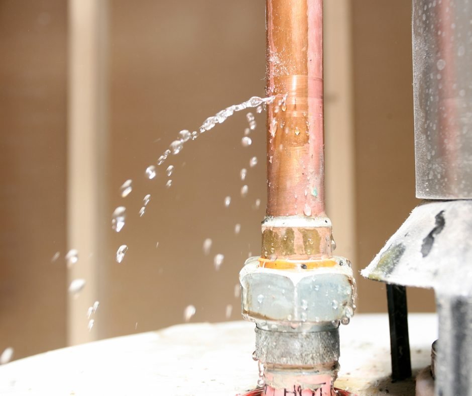 Plumber repairing a leaking water line in Fresno